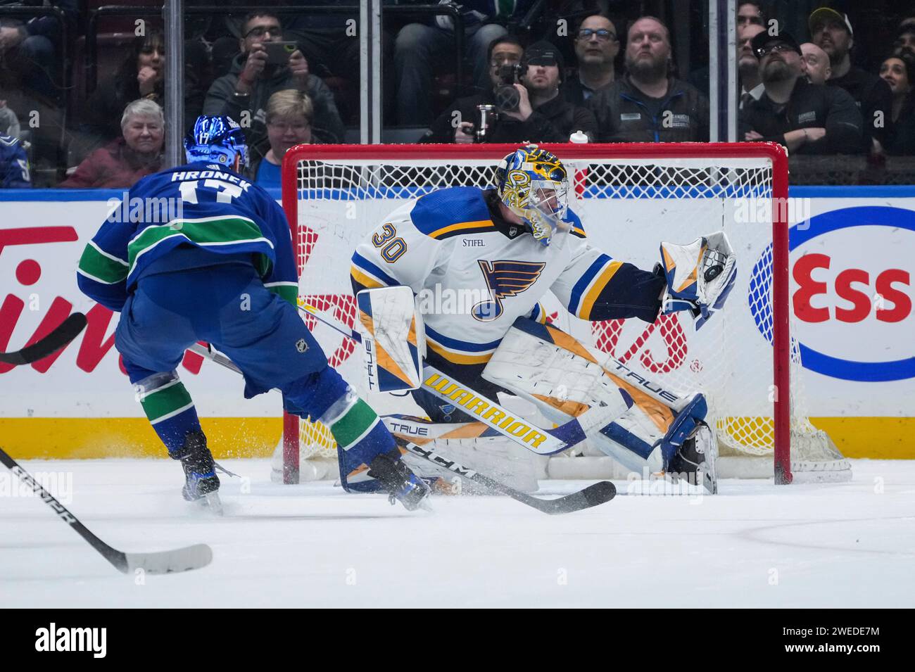 St. Louis Blues Goalie Joel Hofer (30) Stops Vancouver Canucks' Filip ...