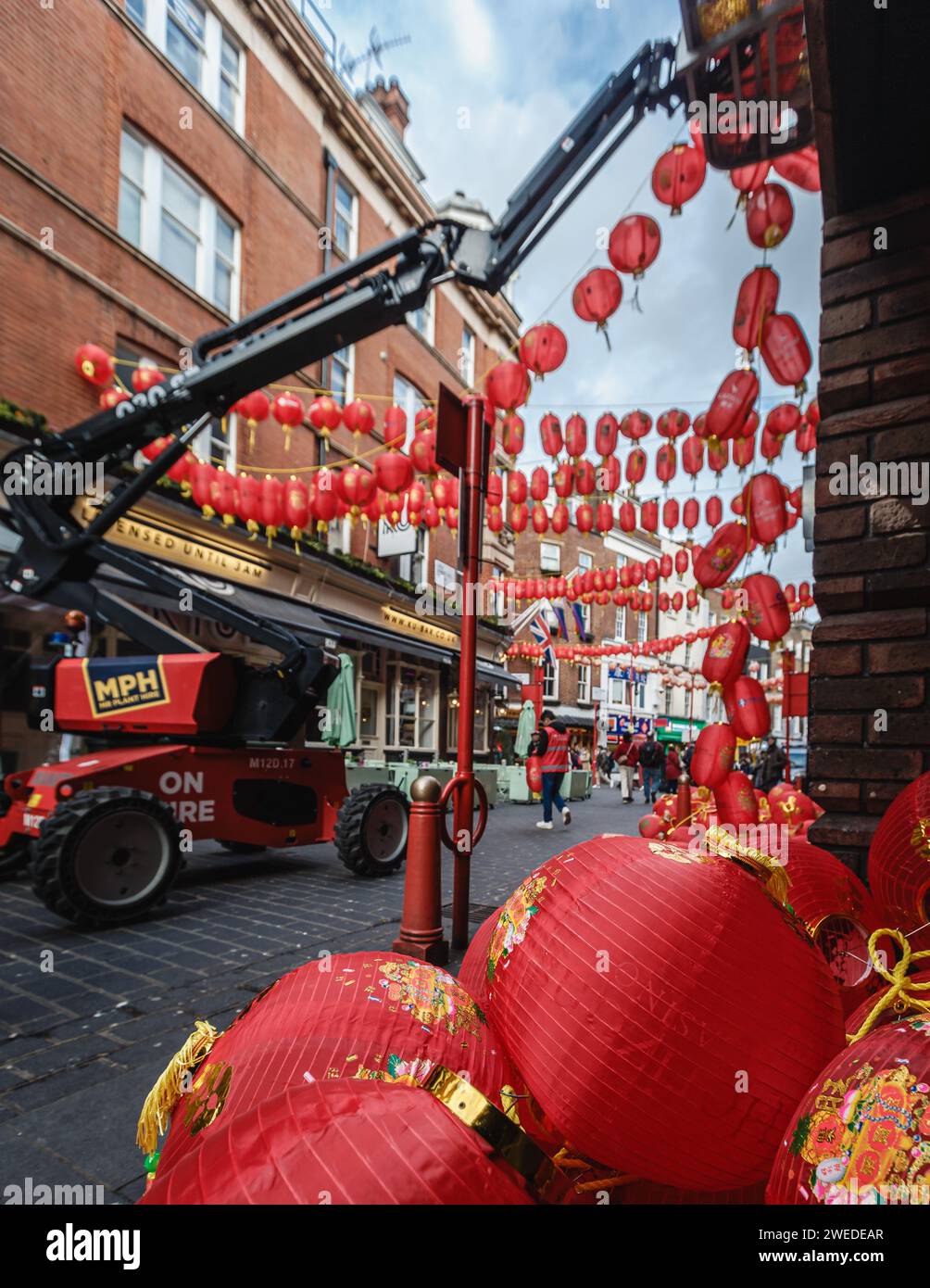 The Chinese Association use a cherry picker to prepare for the Chinese New year in London 2024. Stock Photo