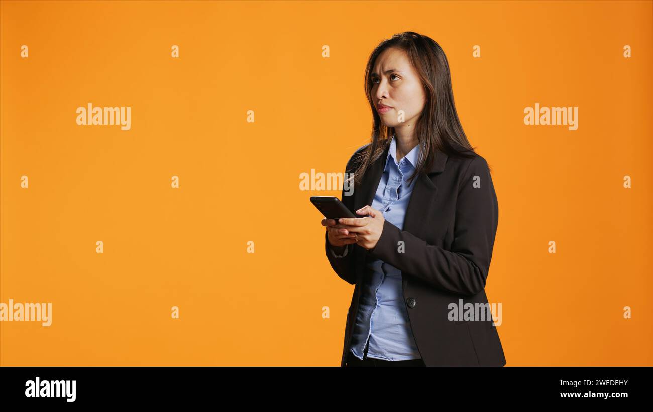 Busy attractive young asian hi-res stock photography and images - Alamy