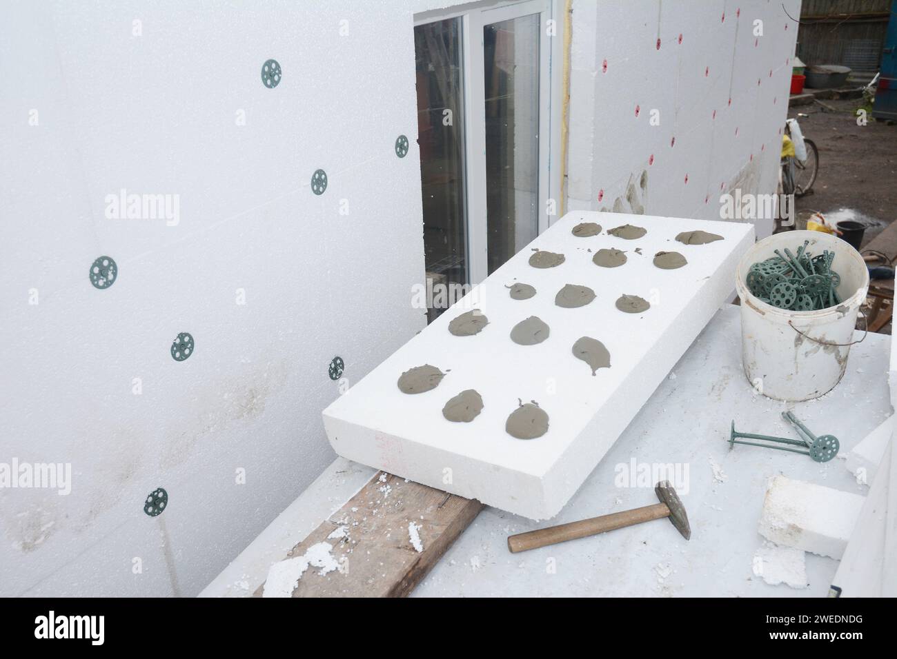 External house wall insulation with polystyrene rigid foam insulation