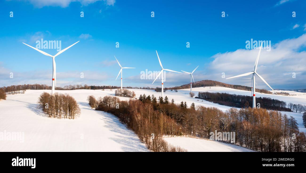 Aerial view of wind turbine farm on the hill in winter sunny day ...