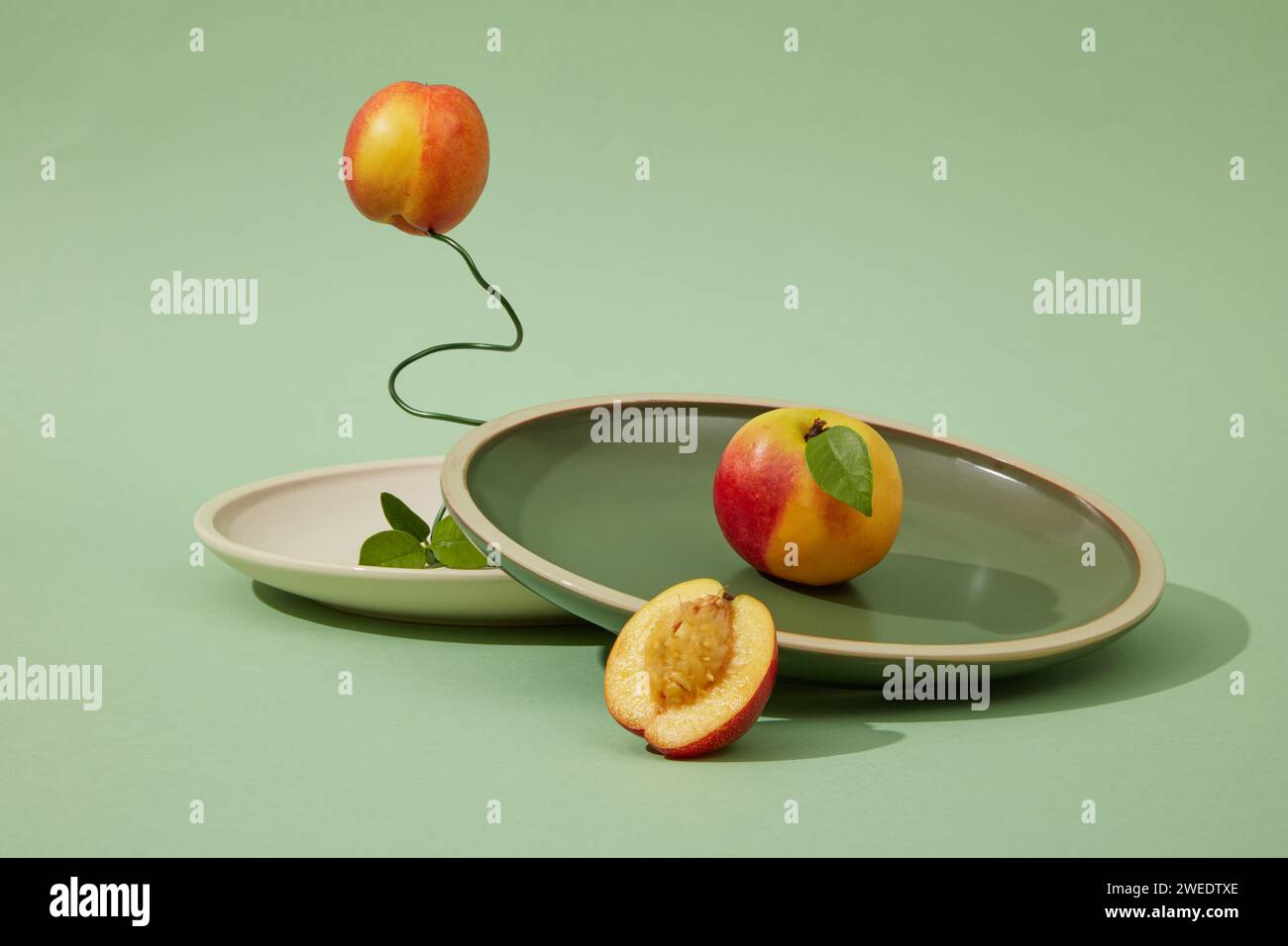 Fresh peaches (prunus persica) with green