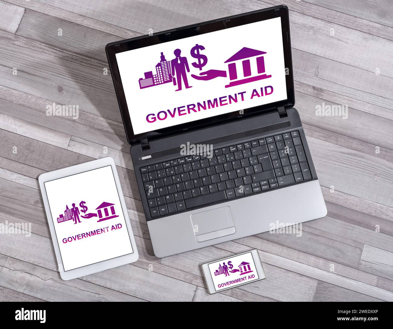 Government aid concept shown on different information technology devices Stock Photo
