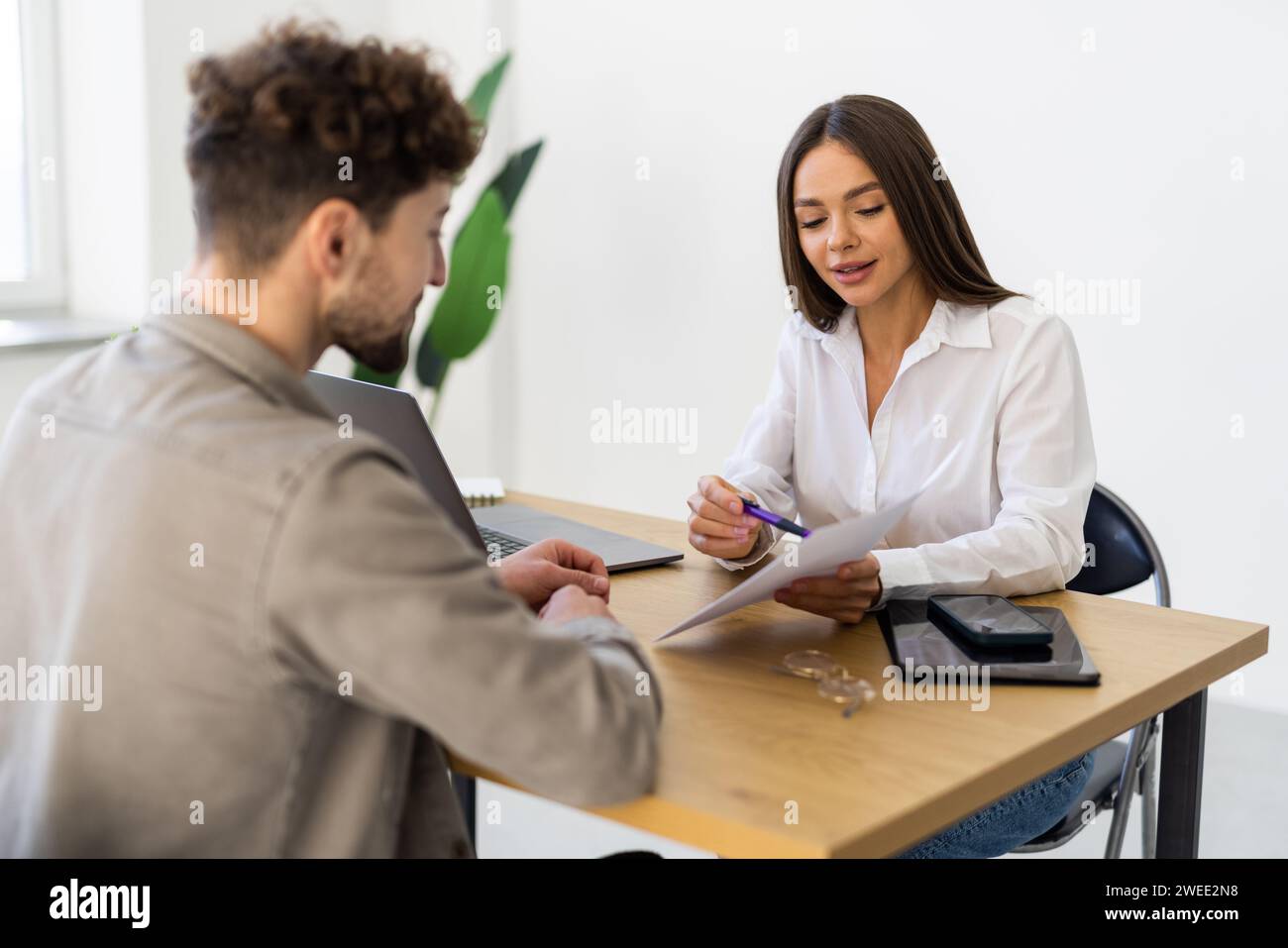 Job seeker in job interview meeting with manager and interviewer at corporate office. The young interviewee seeking for a professional career job oppo Stock Photo