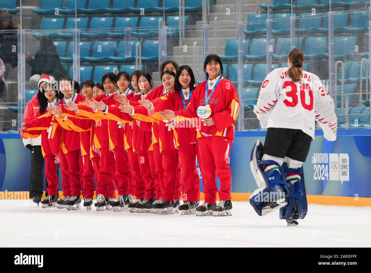 Gangneung, South Korea. 25th Jan, 2024. Players of team China congratulate Csenge Csordas of team Hungary during the victory ceremony for the Women's 3-on-3 Tournament of ice hockey event at the Gangwon 2024 Winter Youth Olympic Games in Gangneung, South Korea, Jan. 25, 2024. Credit: Zhang Xiaoyu/Xinhua/Alamy Live News Stock Photo