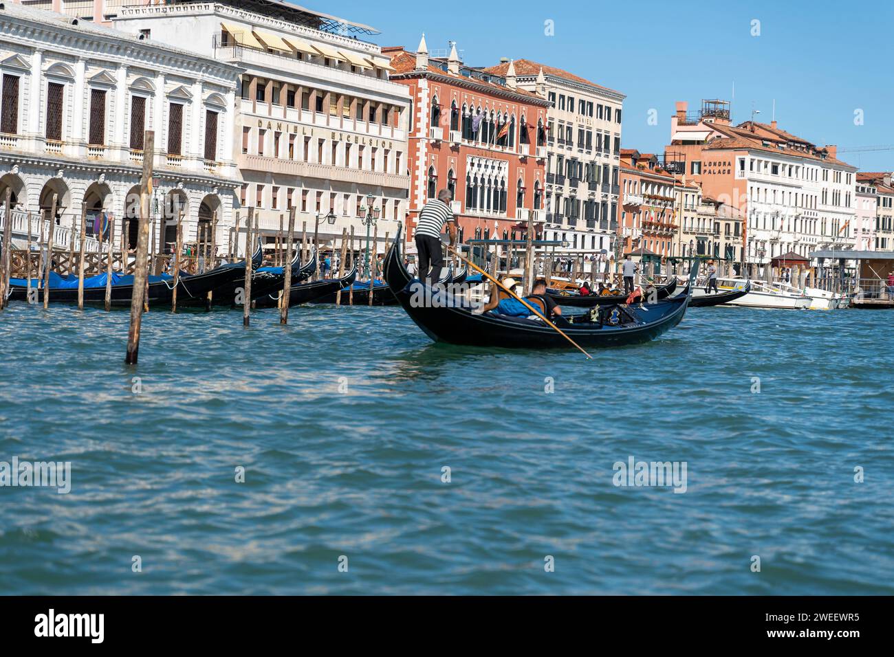 Venice, Italy - September 12, 2022: A small canal in Venice with tourists and gondolas *** Ein kleiner Kanal in Venedig mit Touristen und Gondeln Stock Photo