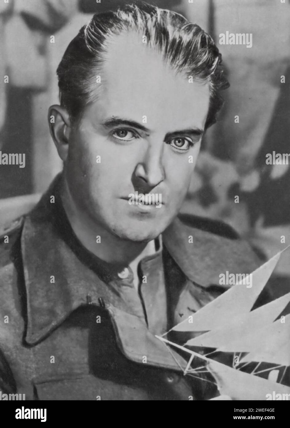 A portrait of Jack Warner, a distinguished actor renowned for his roles in films like 'The Captive Heart' (1946). Warner, known for his strong screen presence and versatile acting skills, brought depth and realism to his portrayal of Captain Karel Hasek in the film, a Czech soldier who assumes the identity of a dead British officer to escape a Nazi POW camp. Stock Photo