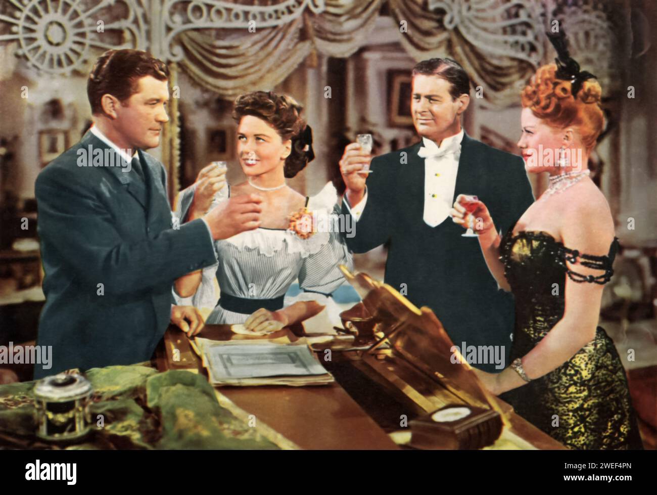 Dennis Morgan, Dorothy Malone, Don DeFore, and Janis Paige star in 'One Sunday Afternoon' (1948), a nostalgic musical comedy. In the film, Morgan plays Biff Grimes, a man who reminisces about his past loves and friendships on a lazy Sunday afternoon. Malone portrays Virginia Brush, the object of Biff's affection, while DeFore and Paige play his friends, Hugo Barnstead and Amy Lind, respectively. Stock Photo