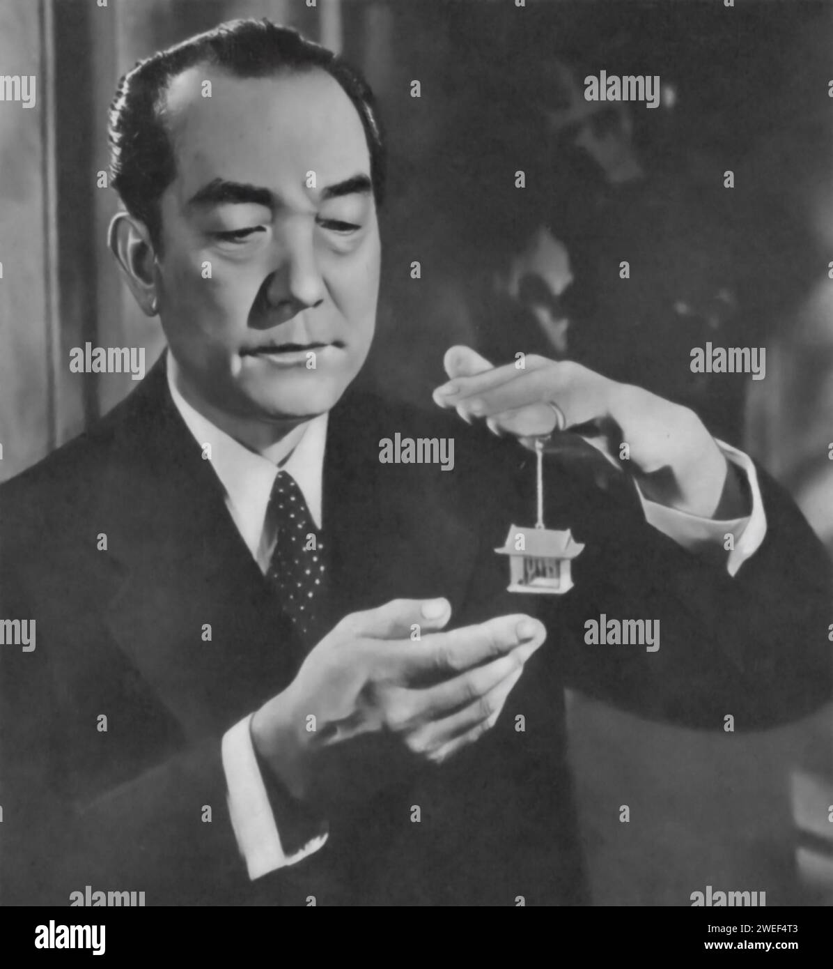 A portrait of Sessue Hayakawa, an actor known for his powerful performance in the film 'Three Came Home' (1950). In this World War II drama, Hayakawa plays Colonel Suga, a Japanese camp commander. His nuanced portrayal adds complexity to the character, depicting him as both a stern authority figure and a man with his own internal conflicts. Stock Photo