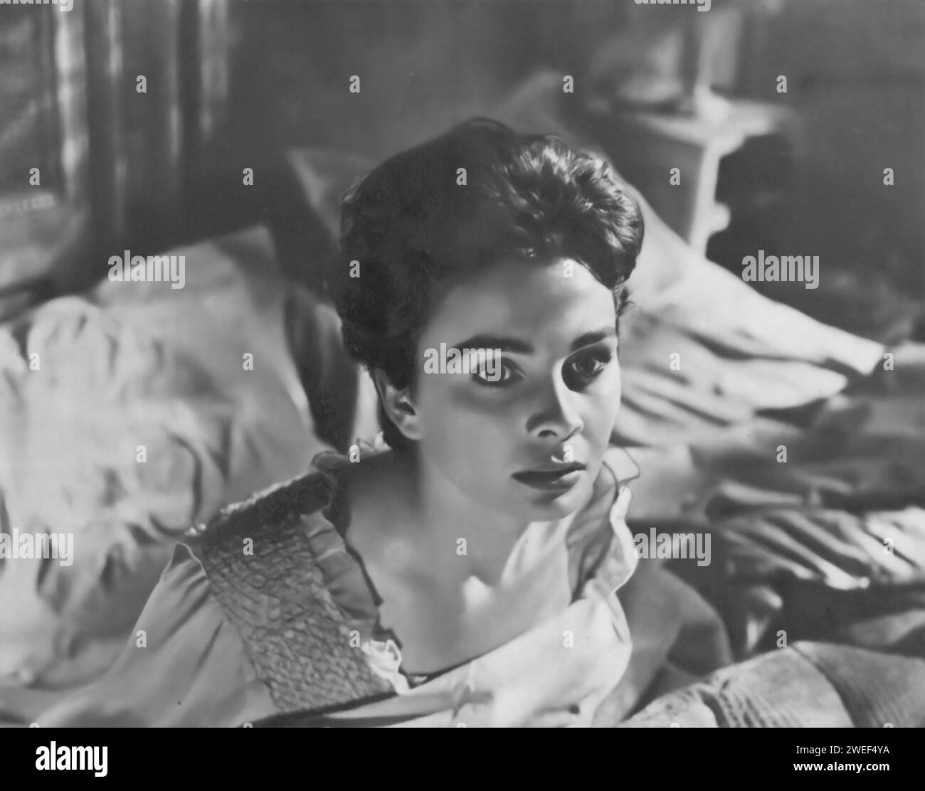 A portrait of Jean Simmons, a celebrated actress known for her role in 'Cage of Gold' (1950). In this British drama, Simmons plays Judith Moray, a young woman who faces emotional turmoil and legal challenges when her presumed-dead husband unexpectedly returns. Stock Photo
