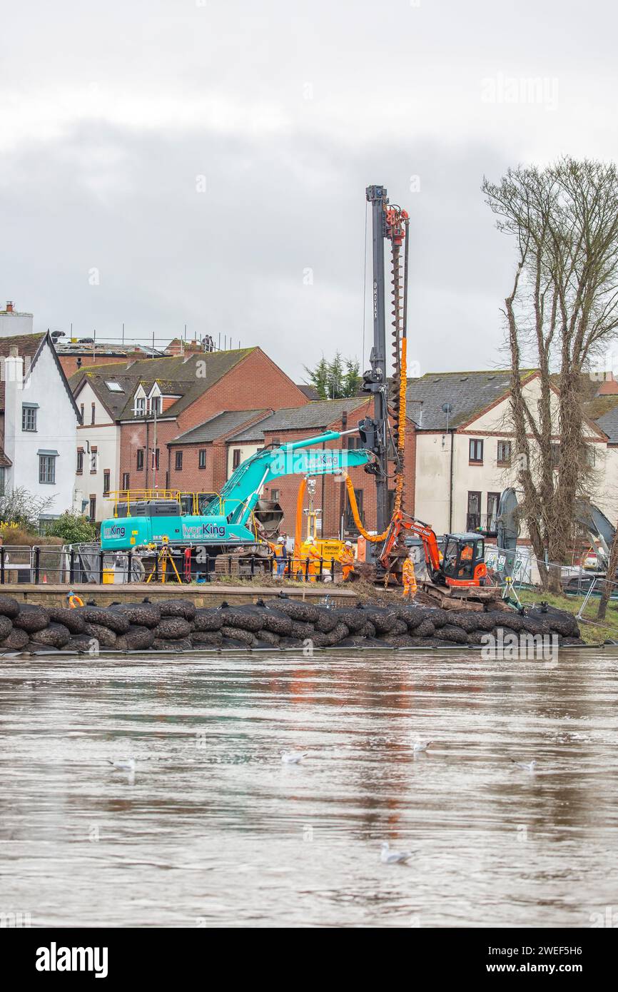 Bewdley, UK. 25th January, 2024. Contractors are busy installing the new River Severn flood defences on the Kidderminster side of the river in Bewdley. Bewdley town centre already has flood defences installed which stop the town from flooding when the river swells. The new defences being installed will protect property and people on the North side of the river in an area called Beale's Corner, which has suffered badly from flood water into properties for many years. Credit: Lee Hudson/Alamy Stock Photo