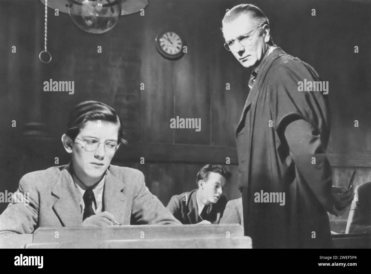 Michael Redgrave stars in 'The Browning Version' (1951), a British drama film. In this adaptation of Terence Rattigan's play, Redgrave portrays Andrew Crocker-Harris, a classics teacher at an English boys' school. The film delves into Crocker-Harris's personal and professional crises, as he confronts his failings and disillusionments both in his career and marriage. Stock Photo