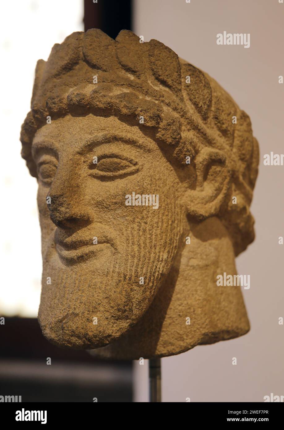 Island of Cyprus. Male head. Late 6th century B.C. Limestone. Barracco Museum. Rome. Stock Photo