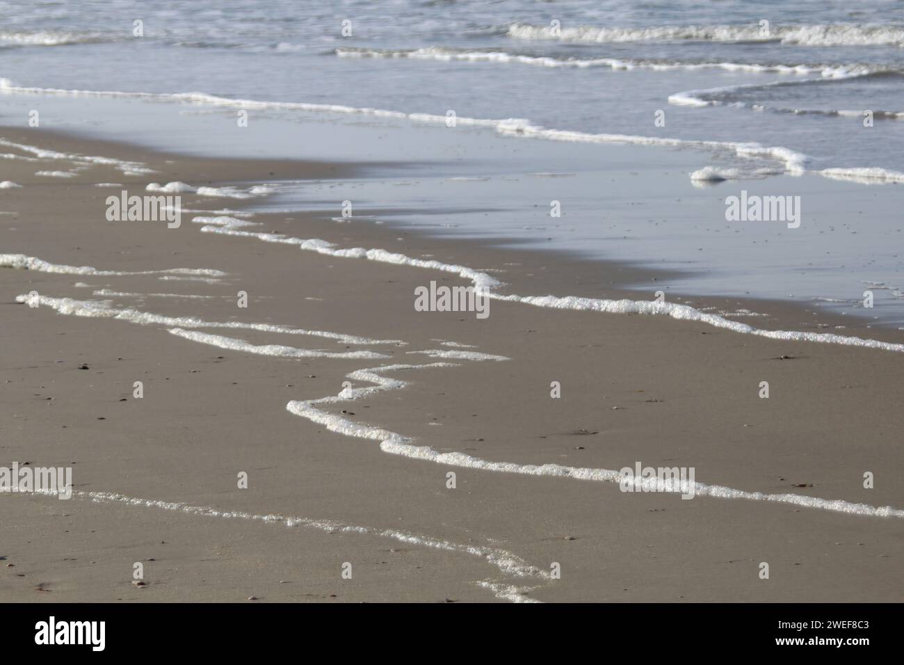 Foamy little Waves Stock Photo