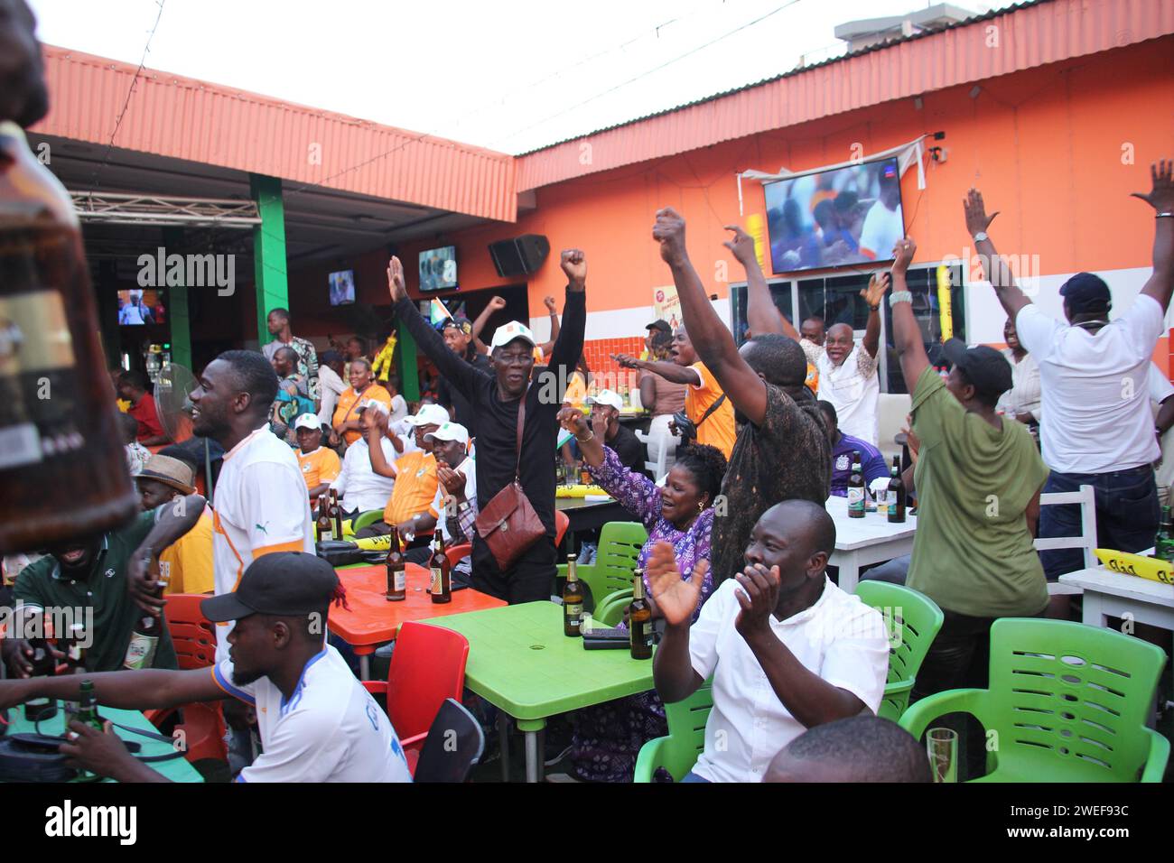 Cotonou, Benin. 22nd Jan, 2024. Local fans watch football matches in a bar during the Africa Cup of Nations (AFCON) in Cotonou, Benin, Jan. 22, 2024. The 34th edition of the AFCON kicked off in Abidjan, Cote d'Ivoire on Jan. 13. Credit: Seraphin Zounyekpe/Xinhua/Alamy Live News Stock Photo