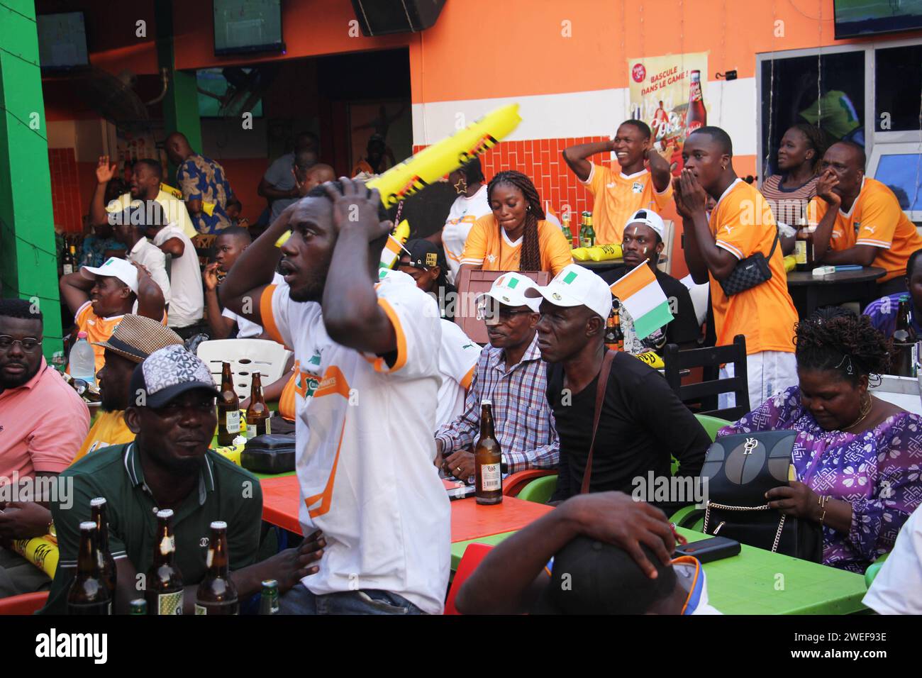 Cotonou, Benin. 22nd Jan, 2024. Local fans watch football matches in a bar during the Africa Cup of Nations (AFCON) in Cotonou, Benin, Jan. 22, 2024. The 34th edition of the AFCON kicked off in Abidjan, Cote d'Ivoire on Jan. 13. Credit: Seraphin Zounyekpe/Xinhua/Alamy Live News Stock Photo