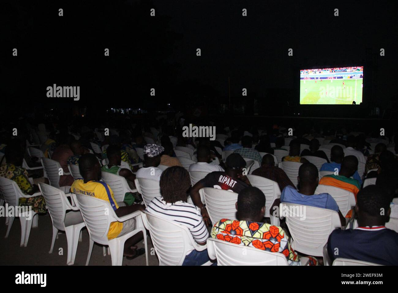 Cotonou, Benin. 22nd Jan, 2024. Local fans watch football match transmissions on an open ground during the Africa Cup of Nations (AFCON) in Cotonou, Benin, Jan. 22, 2024. The 34th edition of the AFCON kicked off in Abidjan, Cote d'Ivoire on Jan. 13. Credit: Seraphin Zounyekpe/Xinhua/Alamy Live News Stock Photo