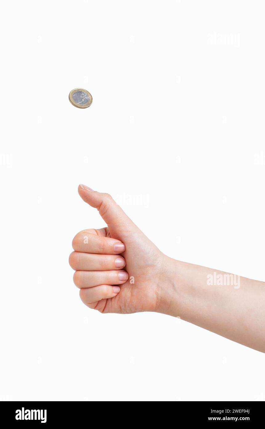 Woman hand tossing a coin isolated on white Stock Photo Alamy