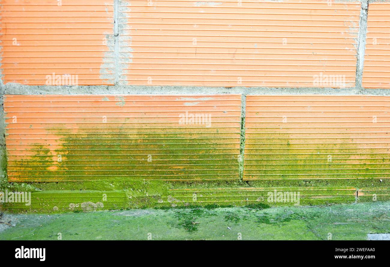 Rain water leaks on the wall causing damage at exterior Stock Photo - Alamy