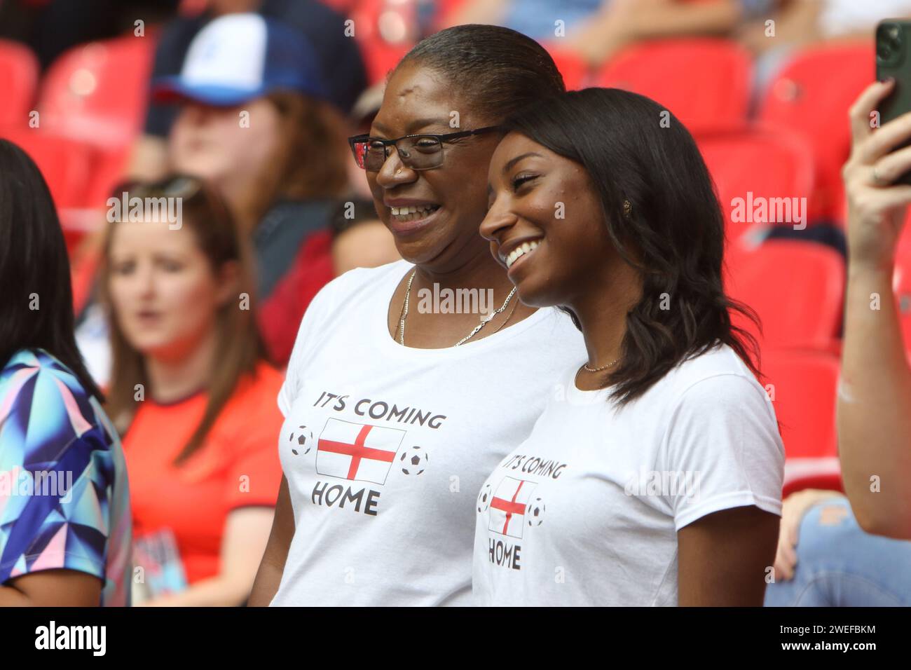 Fans with Its coming home t-shirts UEFA Women's Euro Final 2022 England v Germany at Wembley Stadium, London 31 July 2022 Stock Photo