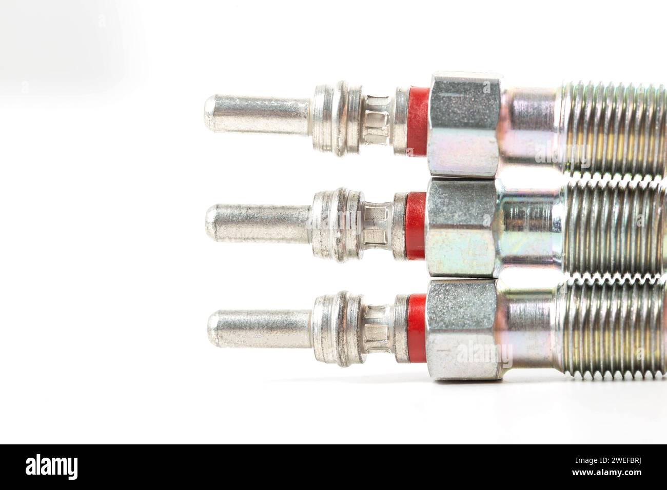 Modern ceramic glow plugs for warming up a diesel engine before starting. White background, isolate. Macro, engine start Stock Photo