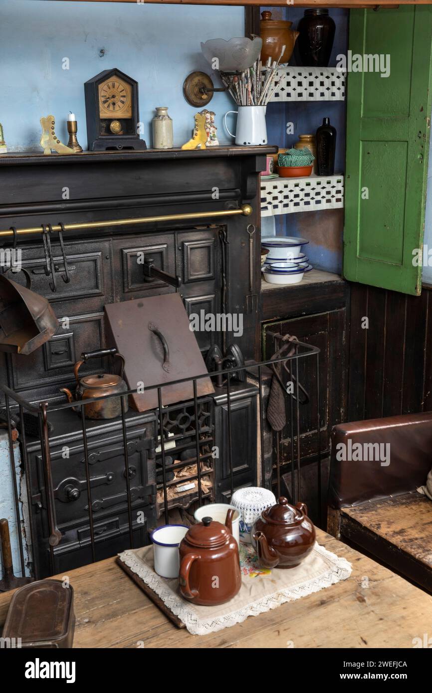 UK, England, West Midlands, Dudley, Black Country Museum, The Village, back-to-back house kitchen table and range Stock Photo