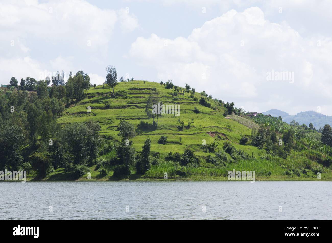 Boat trip in Musanze, Ruhengeri, Rwanda with vivid green islands near Volcanoes National Park in Rwanda Stock Photo
