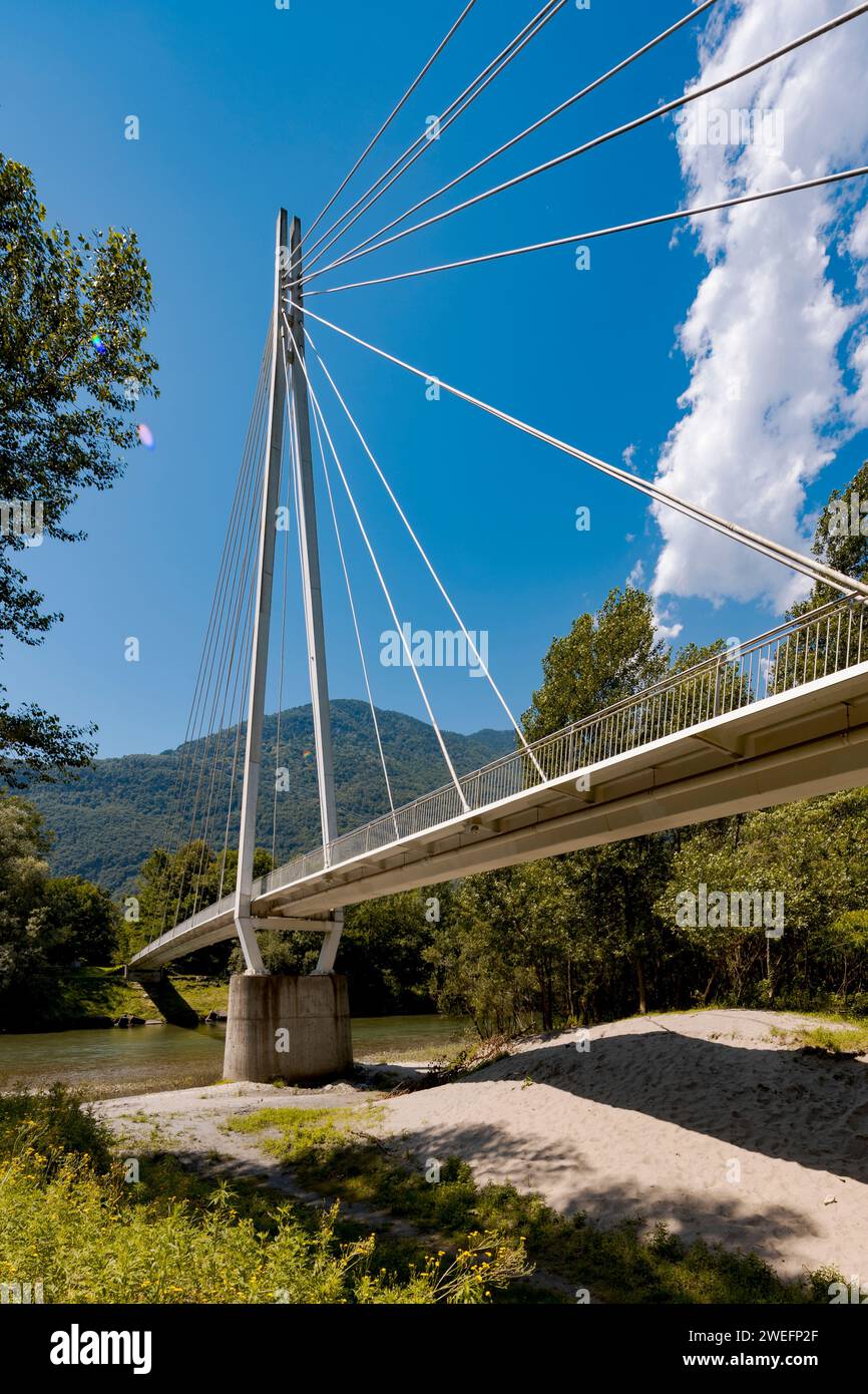 Pedestrian bridge in the middle of the forest, beautiful architecture and a great engineering study. The object is located in Switzerland, it is a sun Stock Photo