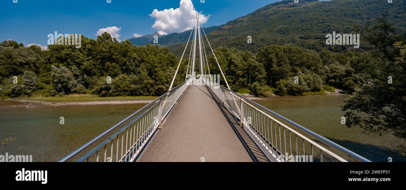 Footbridge in the middle of the forest, beautiful architecture. Below flows the crystalline Ticino river. The object is located in Switzerland, it is Stock Photo