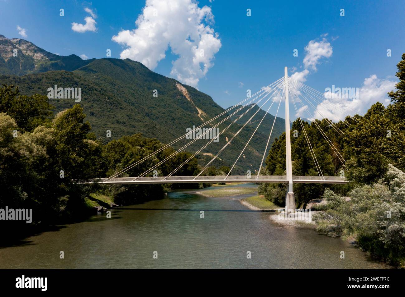 Footbridge in the middle of the forest, beautiful architecture. Below you can see the Ticino River. Evocative calm landscape typical of southern Switz Stock Photo
