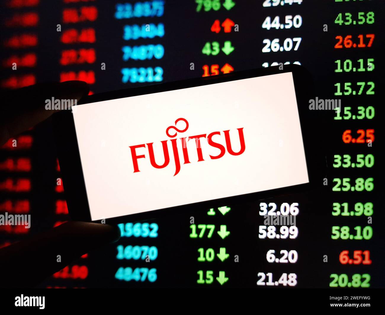 Konskie, Poland - January 24, 2024: Fujitsu company logo displayed on mobile phone screen Stock Photo
