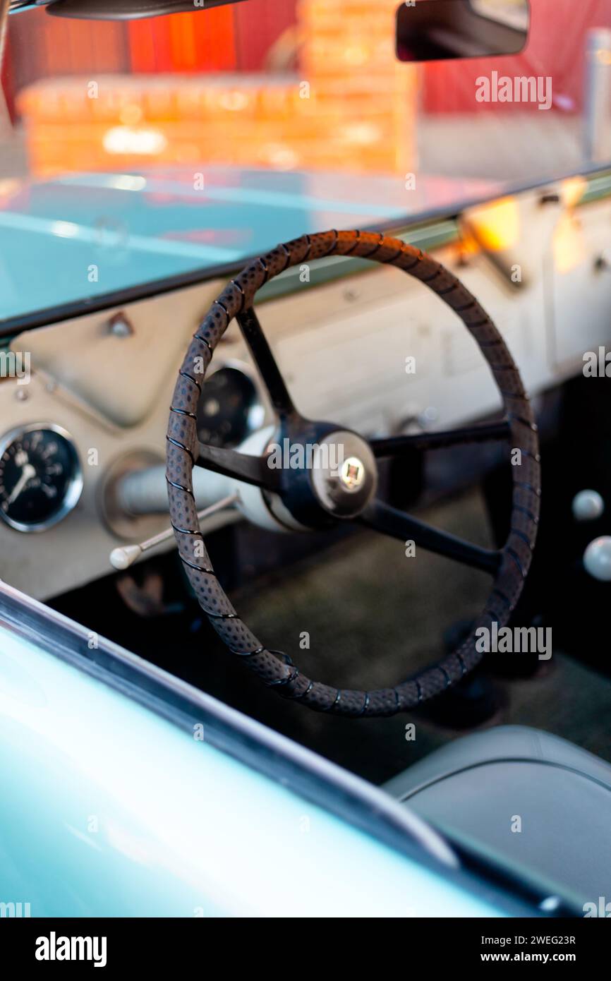 Vintage turquoise car with steering wheel Stock Photo