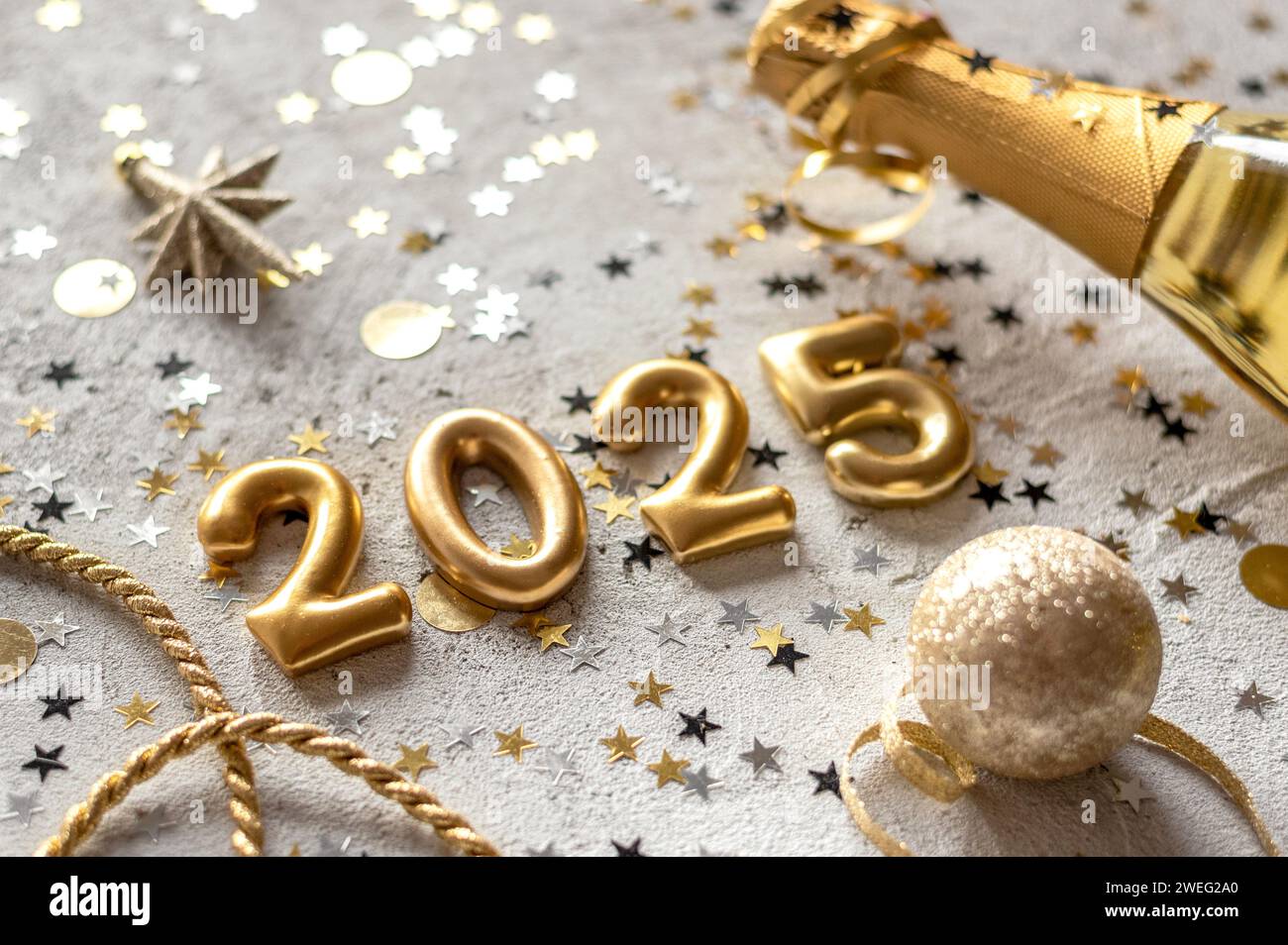 Golden color palette photo with new year 2025 numerals surrounded by