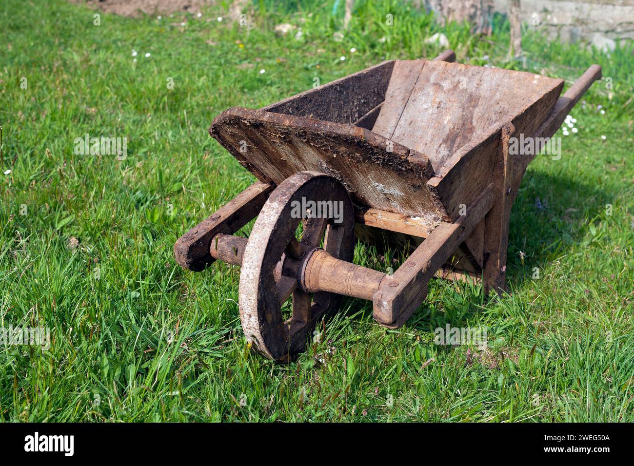 Very old wooden wheelbarrow Stock Photo