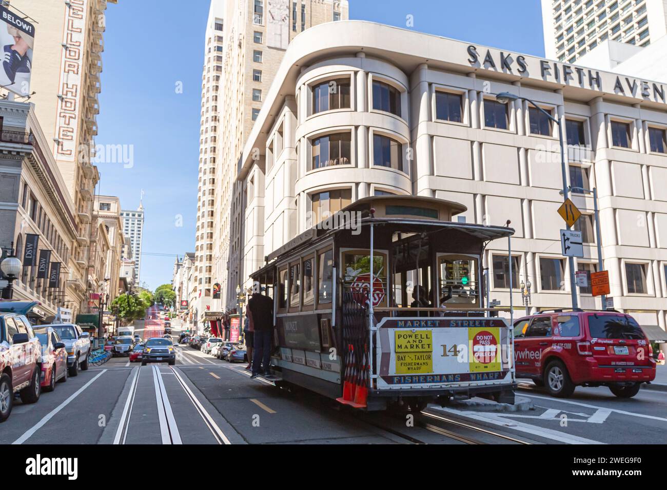 San Francisco, California, USA - 22 April, 2017- Cable car ascends popular hill of Powell Street in vibrant downtown area of Union Square in downtown San Francisco. Old tram on street of San Francisco Stock Photo