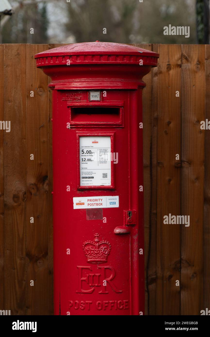 Harefield, UK. 25th January, 2024. A postal box next to a Post Office
