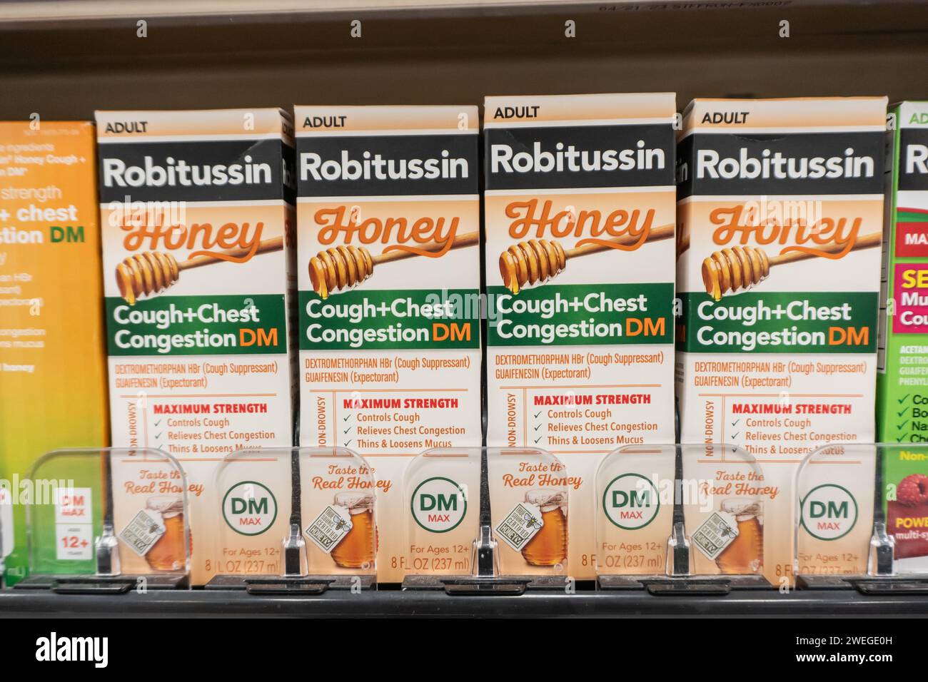 Spring Township, Pennsylvania - January 25, 2024: Robitussin Honey Max Strength Cold, Flu and Sore Throat Medication on pharmacy shelf Stock Photo