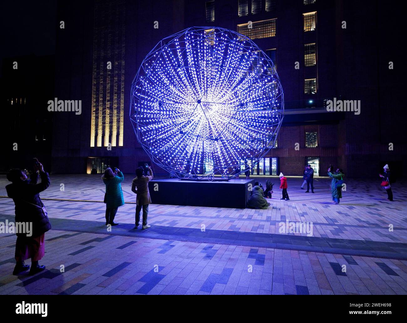 People look at Singularity by Squidsoup, one of the seven installations on display at the