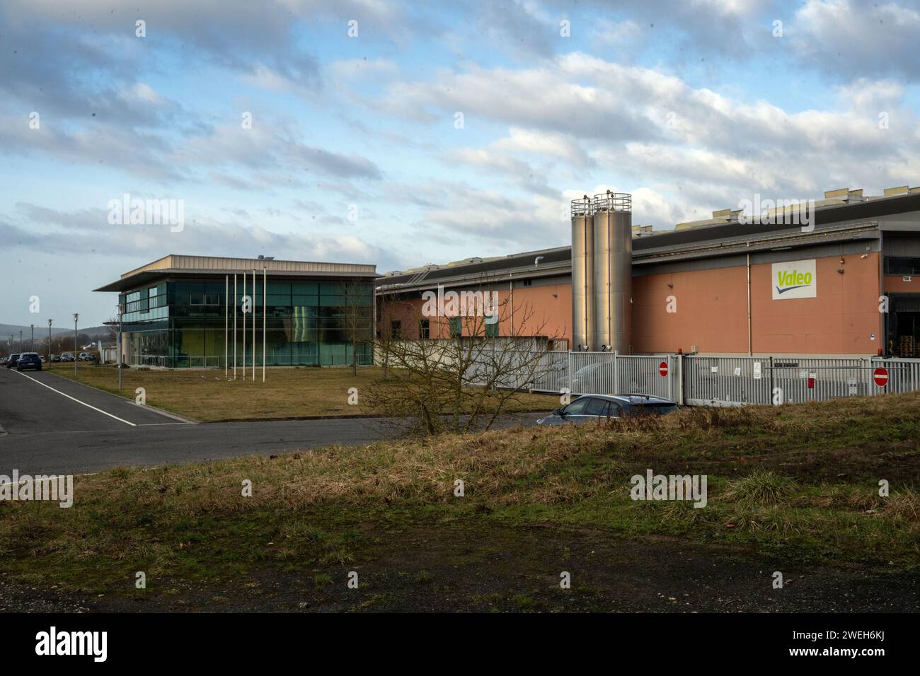 Fischbach, Germany. 25th Jan, 2024. The Valeo logo is emblazoned on one of the automotive supplier's buildings. Credit: Pia Bayer/dpa/Alamy Live News Stock Photo