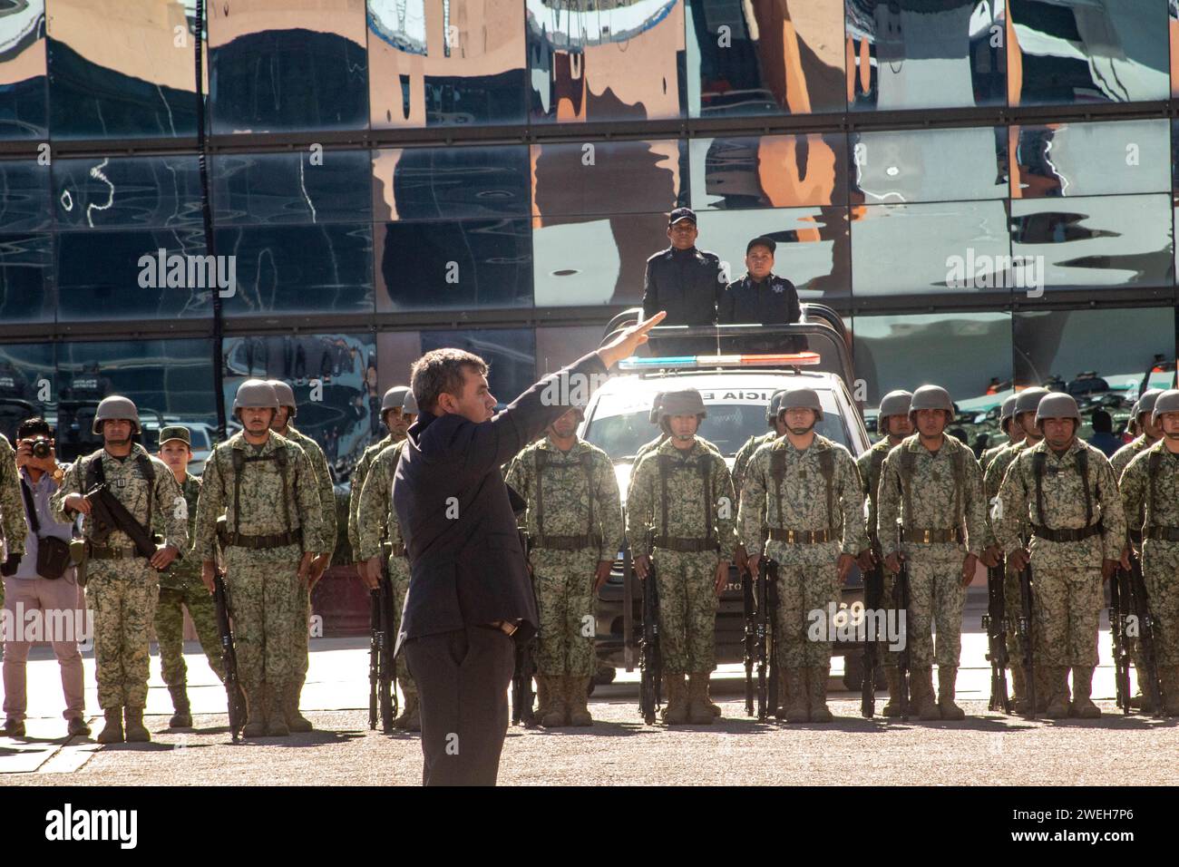 Chilpancingo, Guerrero, Mexico. 25th Jan, 2024. Rolando Solano Rivera  protests the position of Secretary of Public Security of Guerrero in the  executive branch, surrounded by armed soldiers in a solemn civil ceremony