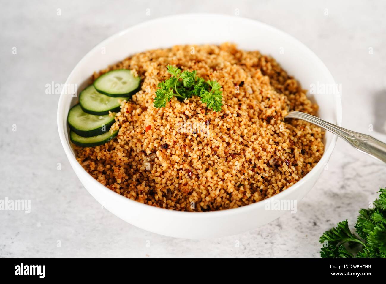 Homemade Moroccan couscous served in a bowl, selective focus Stock Photo