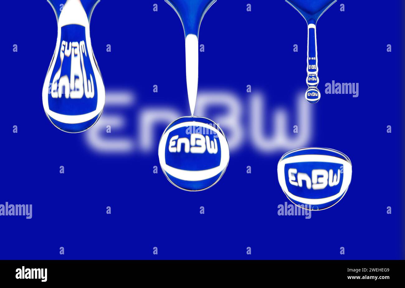 macro shot of a drop of water dripping, the logo of EnBw, Energie Baden-Württemberg, is reflected in the drop Stock Photo