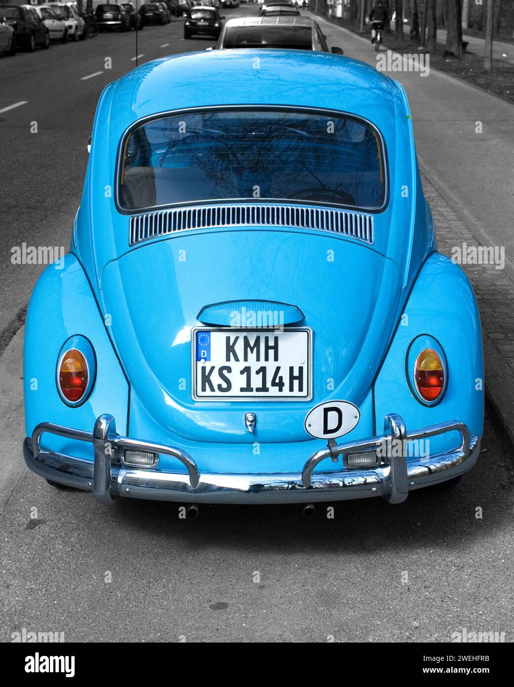 Rear of a light blue VW Volkswagen Beetle parked at the roadside, the number plate, licence plate, has been changed, the initial letters, place abbrev Stock Photo