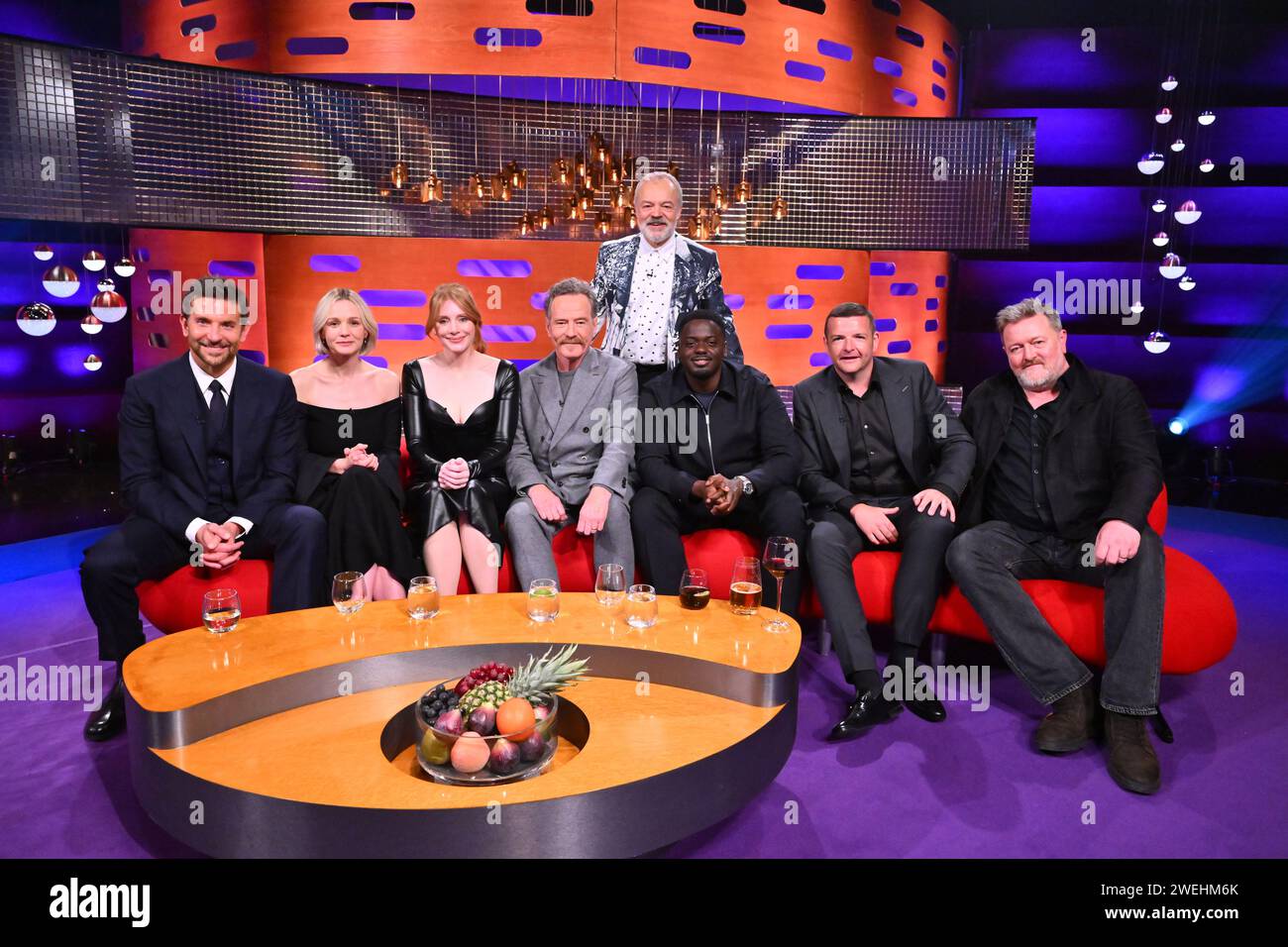 EDITORIAL USE ONLY Bradley Cooper, Carey Mulligan, Bryce Dallas Howard, Bryan Cranston, Daniel Kaluuya and Kevin Bridges with host Graham Norton during the filming for the Graham Norton Show at BBC Studioworks 6 Television Centre, Wood Lane, London, to be aired on BBC One on Friday evening. Picture date: Thursday January 25th, 2024. Photo credit: Matt Crossick/PA Wire Stock Photo