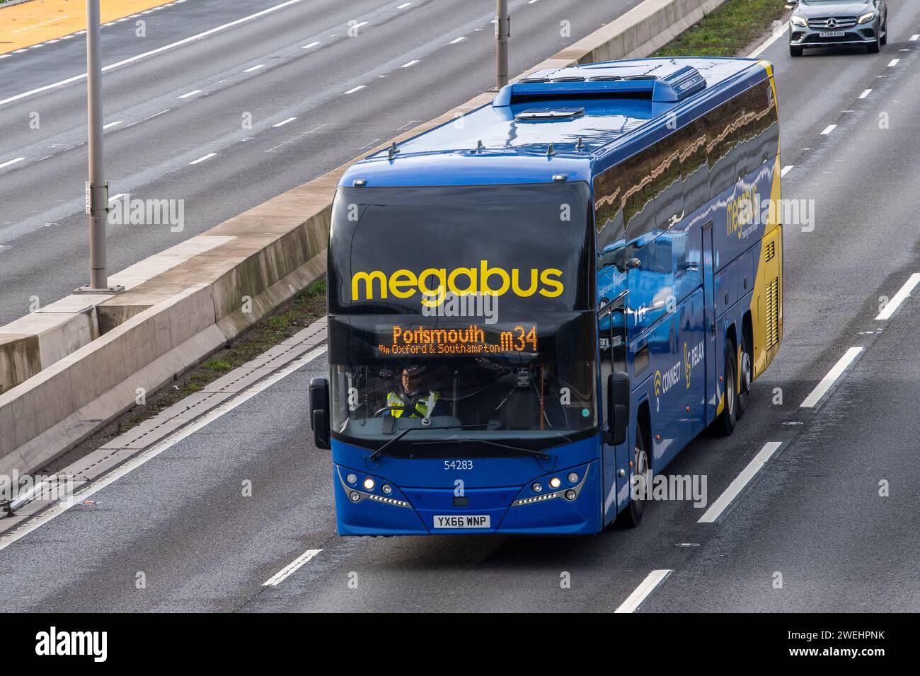 Megabus coach on the M6 motorway near Birmingham, heading for Portsmouth, UK. Stock Photo