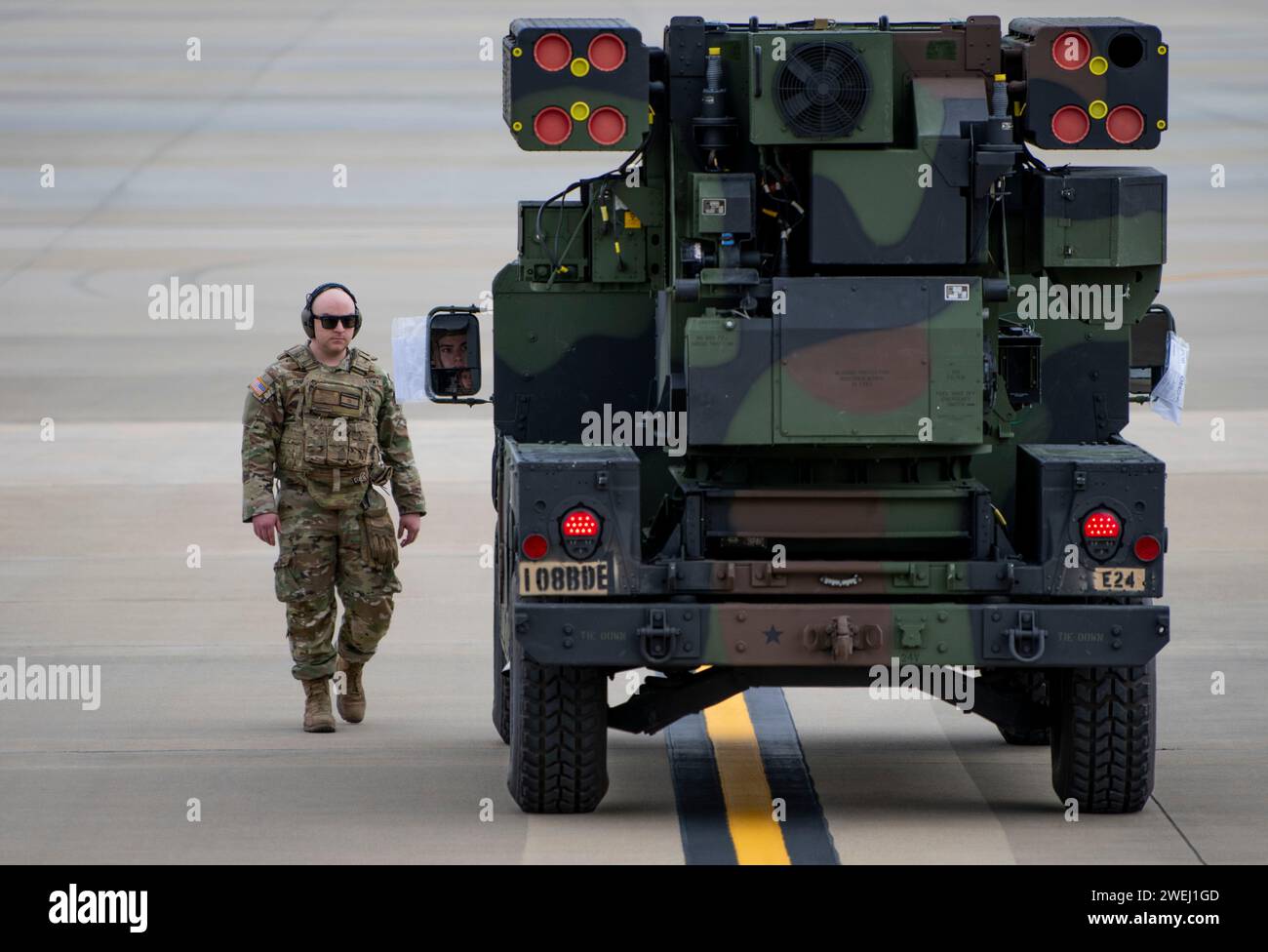A U.S. Army Soldier helps guide an Avenger Air Defense System onto a ...