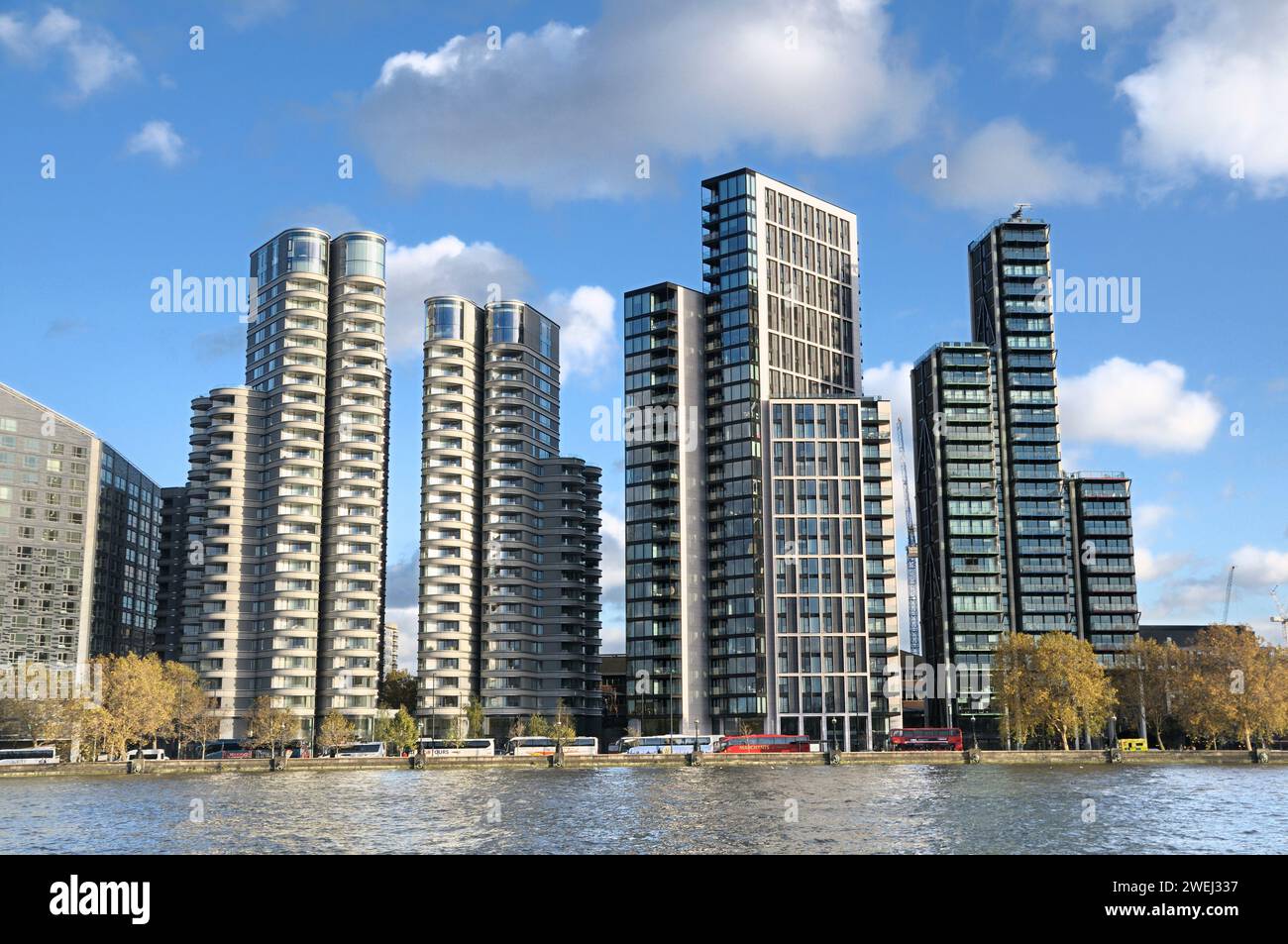 Luxury modern apartment blocks on River Thames, Albert Embankment, Vauxhall / Nine Elms development, London. (L-R) The Corniche and Merano Residences. Stock Photo