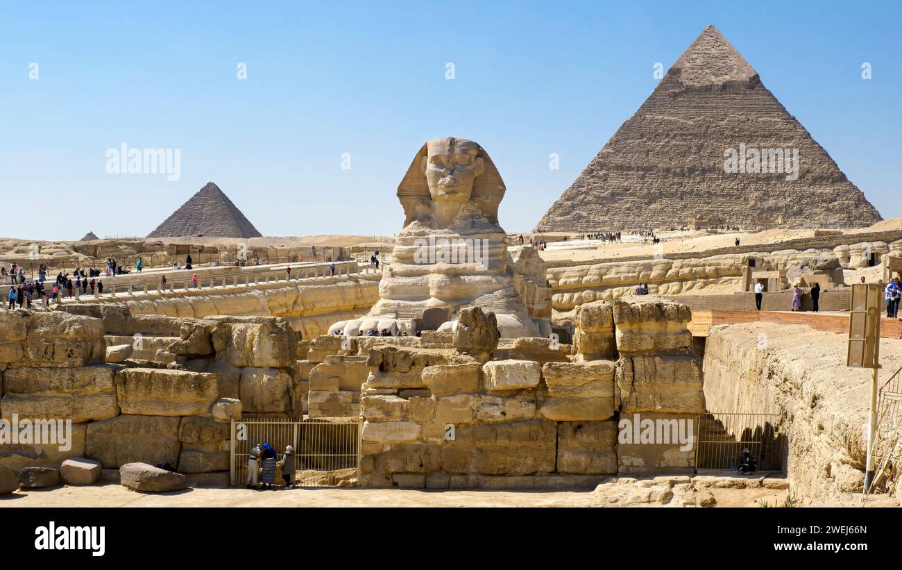 The Great Sphinx of Giza, a limestone statue of a reclining sphinx, in front of the Pyramid of Khafre, near Cairo, Egypt. Stock Photo