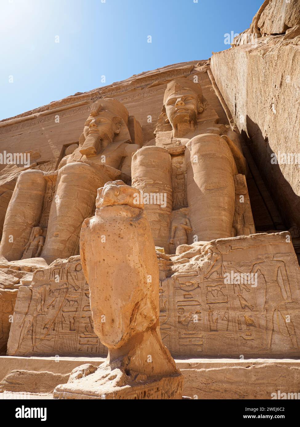 The Great Temple of Abu Simbel with its four iconic 20 meter tall seated colossal statues of Ramses II, Egypt. Stock Photo
