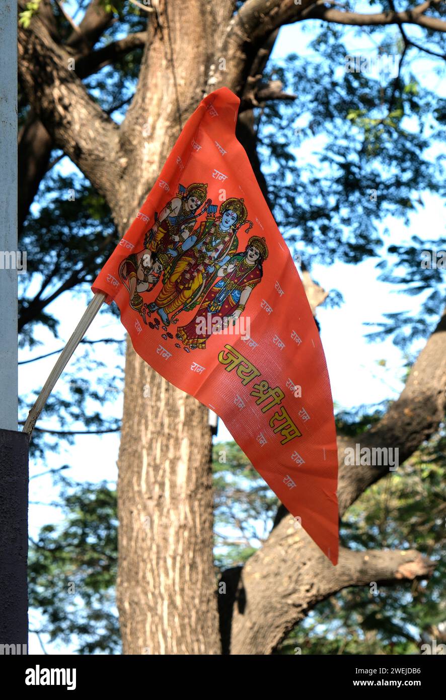 Flag attached to a pole depicting Lord Rama with Goddess Sita, Laxman and Lord Hanuman Stock Photo